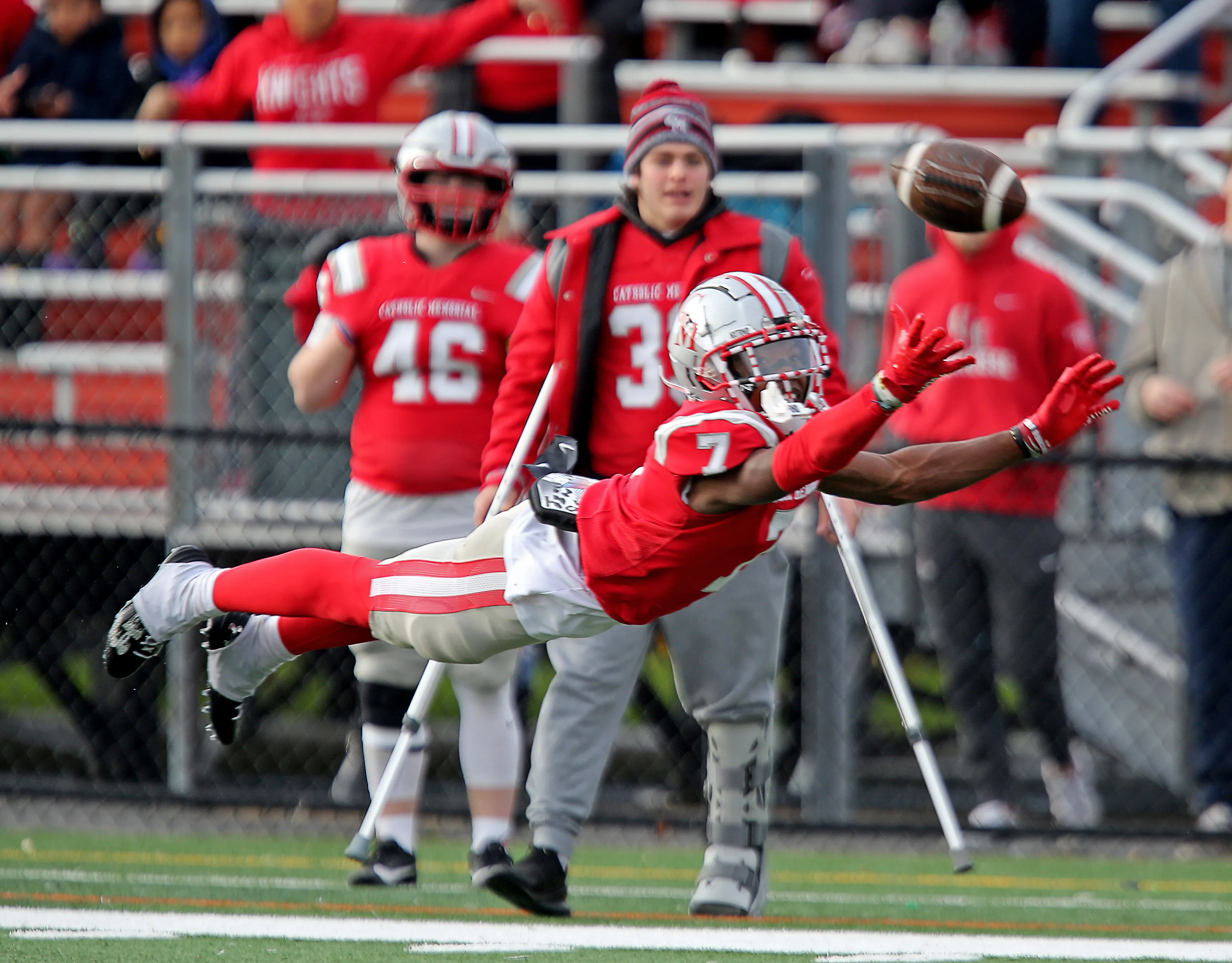 Thomas Kuefler playing football for Catholic Memorial