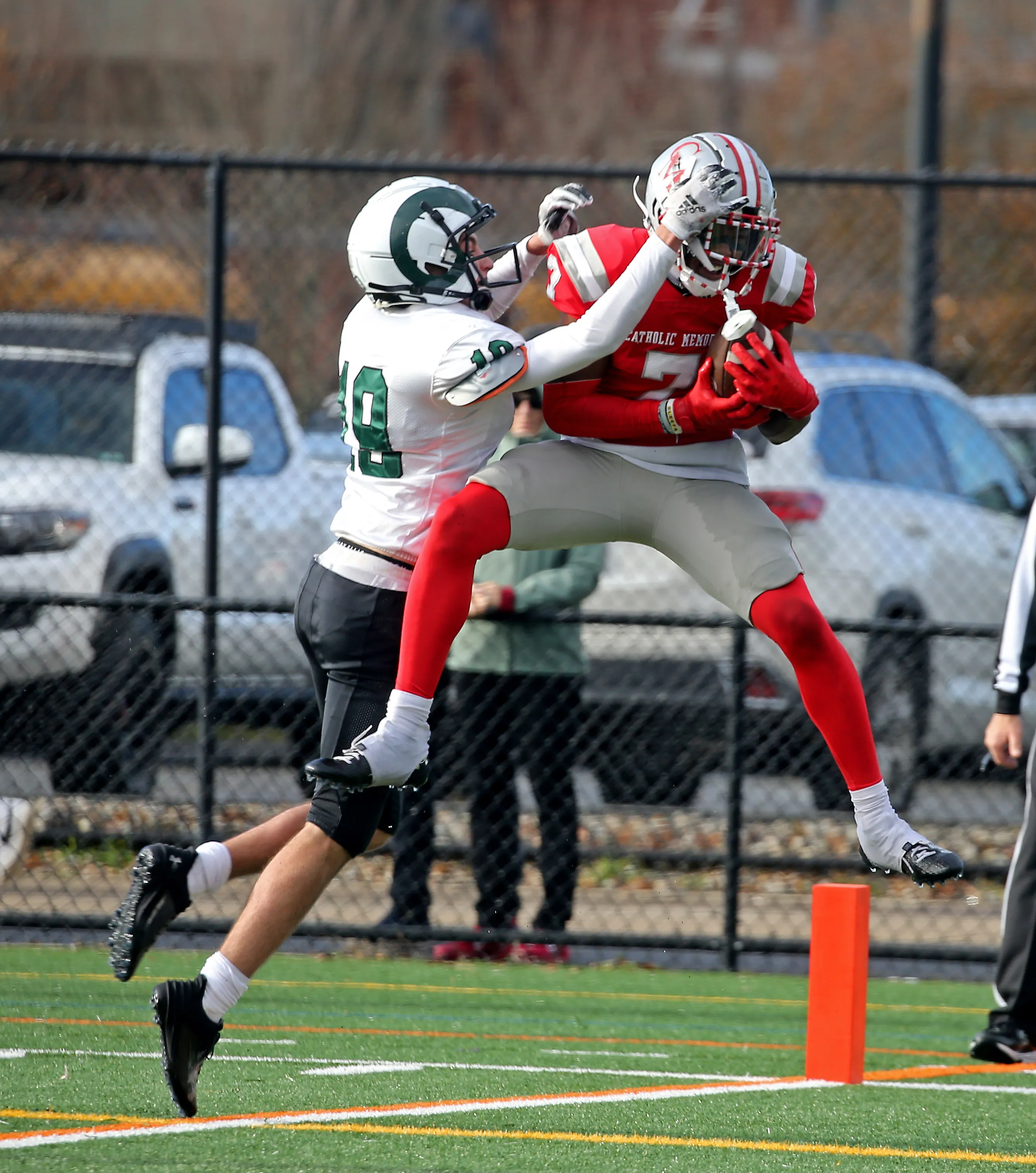 Thomas Kuefler playing football for Catholic Memorial