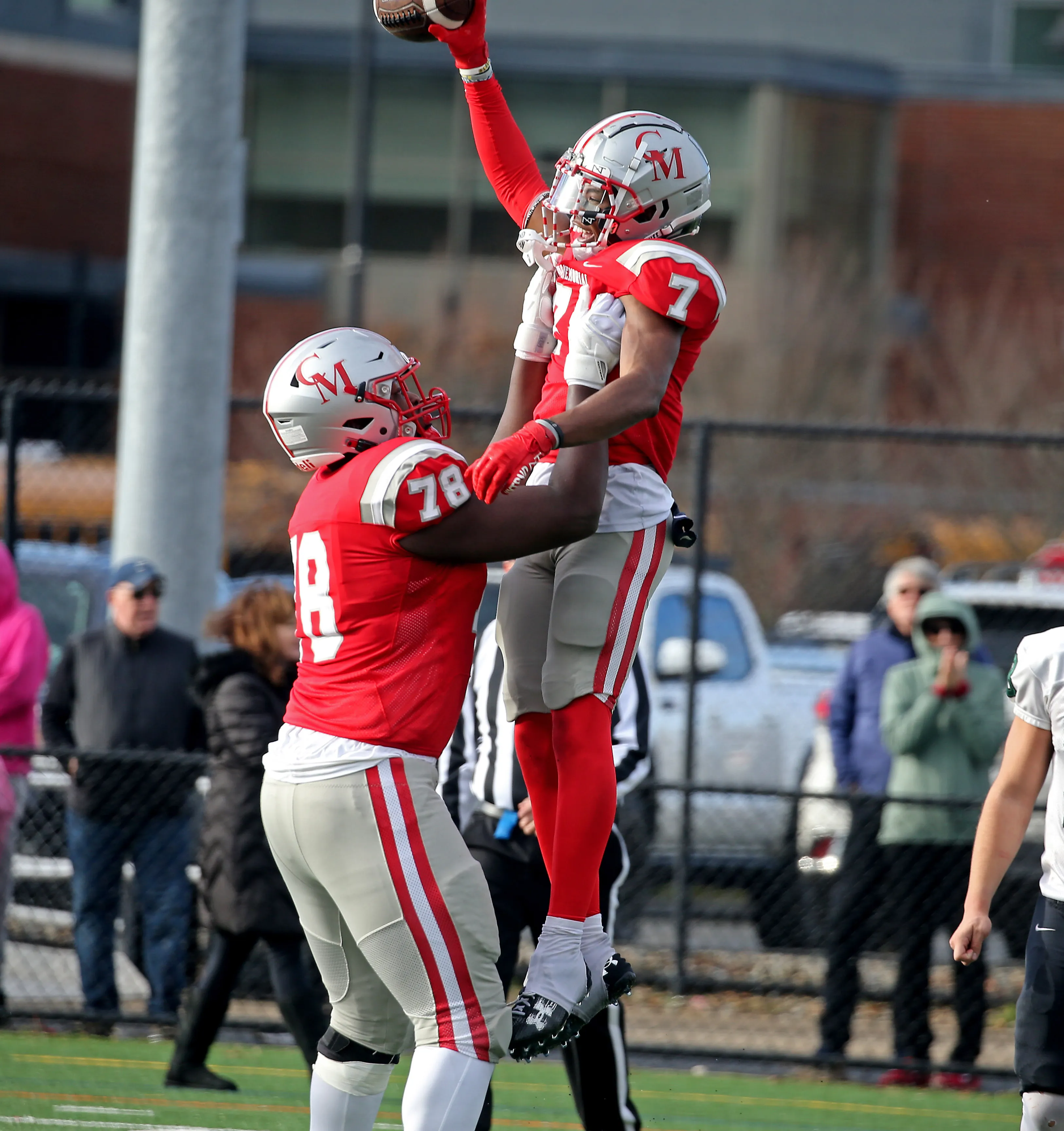 Thomas Kuefler playing football for Catholic Memorial